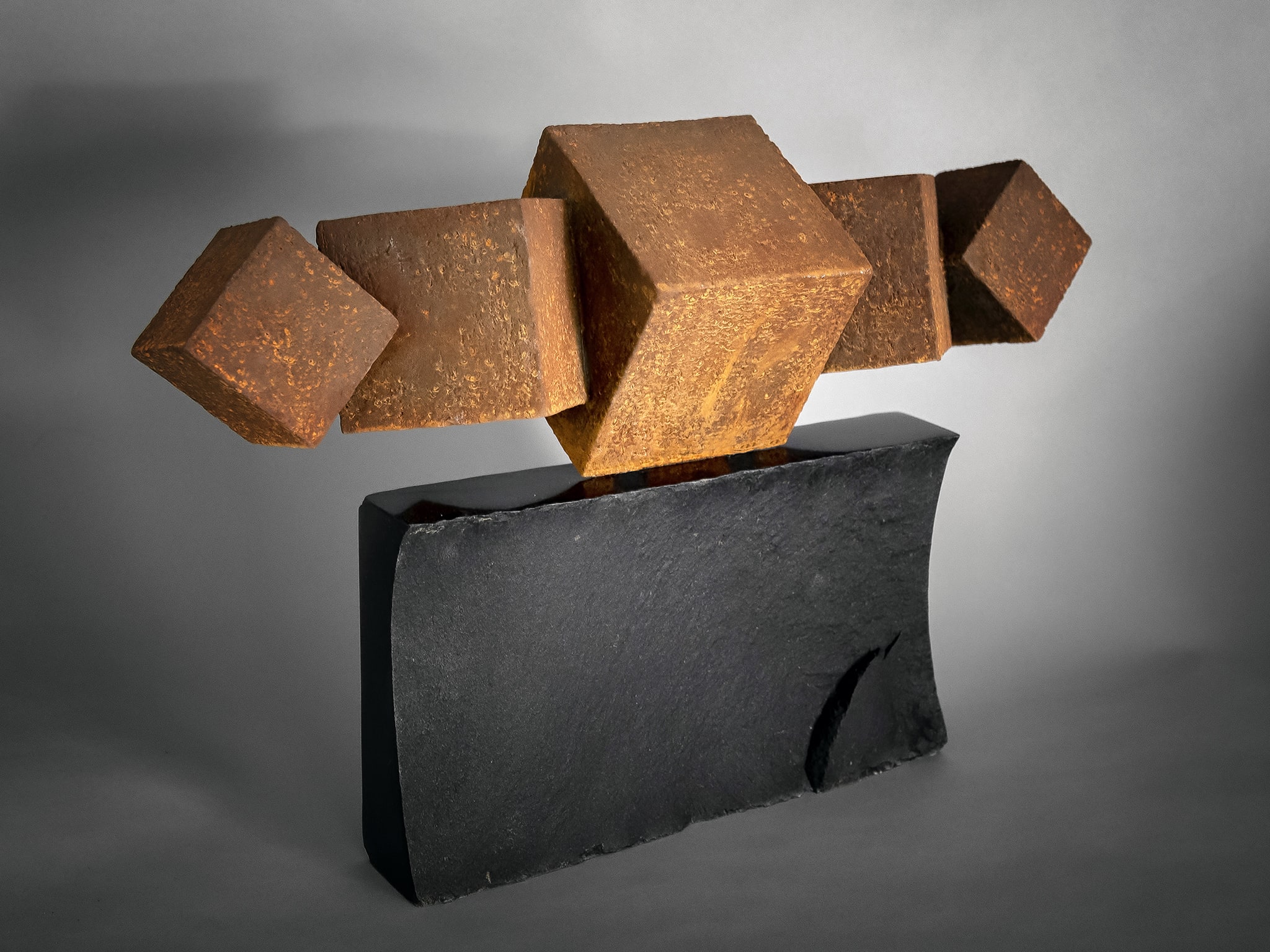 Geo Cubes, 15" x 22" x 7.5", clay with iron oxide finish on black basalt