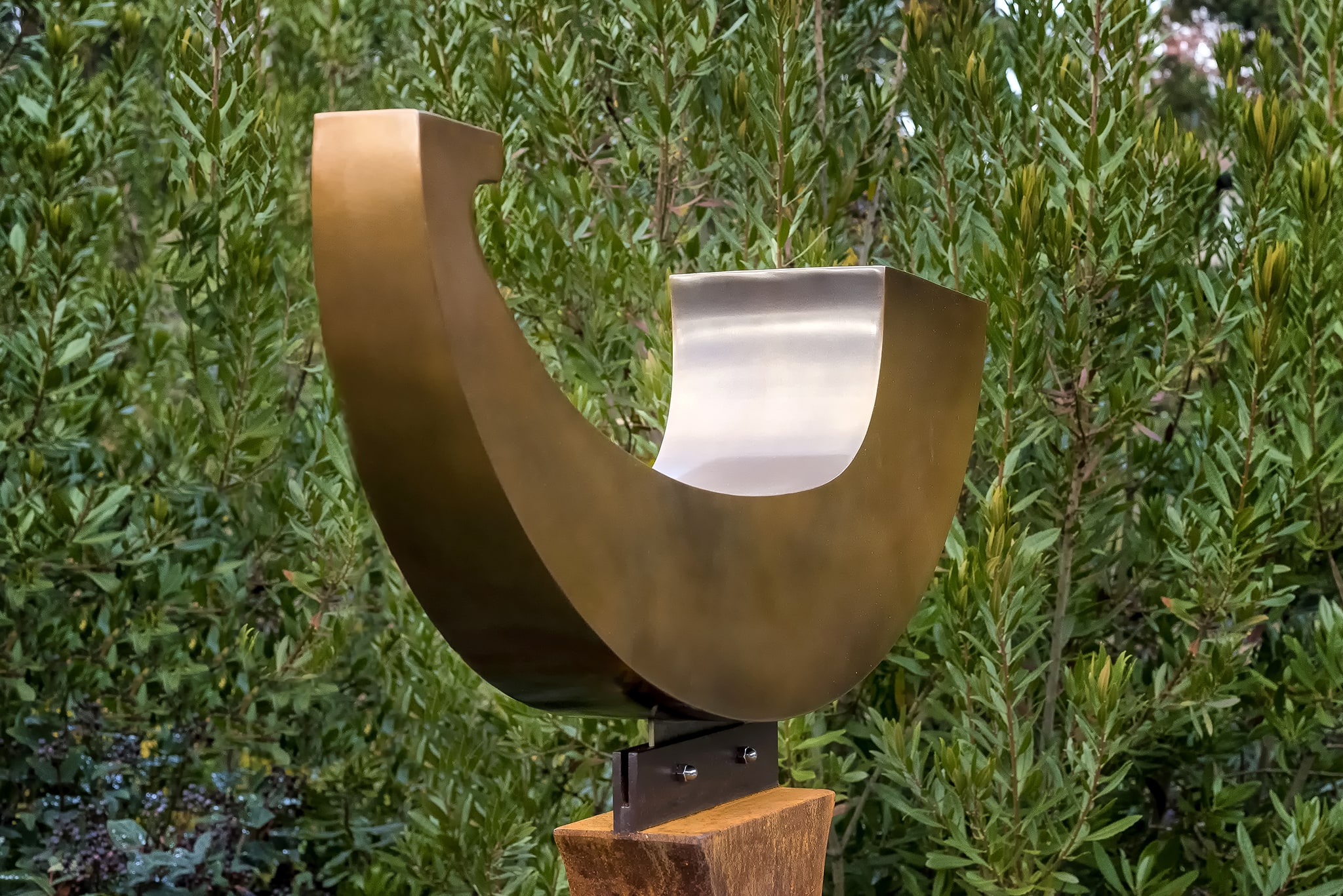 Nordic Arc, 5' 7" x 2' 11" x 11", bronze on Corten steel base